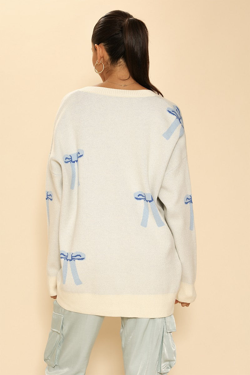 ADRIANNE BOW DESIGN CARDIGAN | CREAM/BLUE