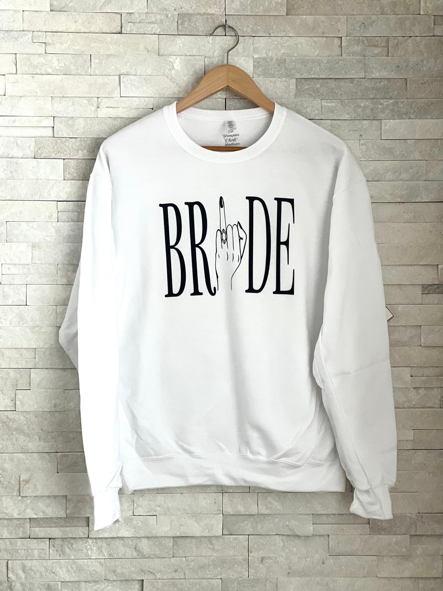 Introducing the Ring Finger Bride crewneck sweatshirt. Made of 50-50 cotton/poly blend, this sweatshirt is perfect for casual wear on lazy Sundays or any other day you want to feel cozy and comfortable. Its white colour makes it suitable for any occasions too! Pair it up with matching pants and shoes for a complete look or work out in style during the workout session.