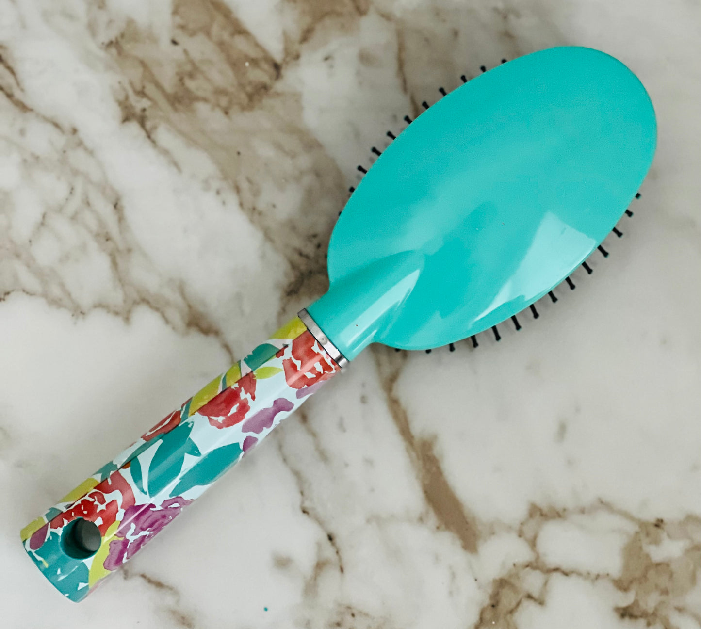 What's more beautiful than a floral brush? How about one that's personalized with your name! When you're searching for the perfect hairbrush, look no further than this custom personalized hair brush. This oval hairbrush is crafted with the highest quality materials and designed to last. We know you'll love using it every day - it feels amazing on your hair and leaves it looking voluminous and luxurious. Plus, with its chic floral design, it is also chic. Teal
