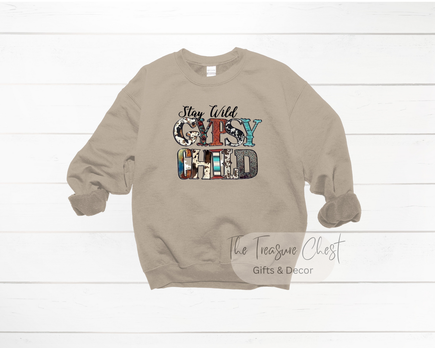 Introducing the Stay Wild Gypsy Child Crewneck Sweatshirt - the perfect way to express your wild side! This cozy and stylish sweatshirt features a classic crewneck cut that's perfect for layering over any outfit. It's made from a high-quality cotton-poly blend for a comfortable fit that's both warm and breathable. Sand In colour